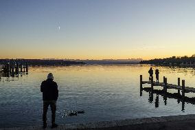 People Enjoying A Winter Evening At Lake Starnberg