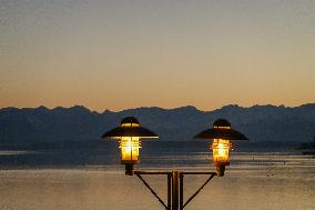 People Enjoying A Winter Evening At Lake Starnberg