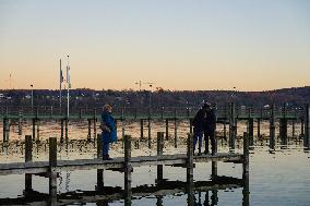 People Enjoying A Winter Evening At Lake Starnberg