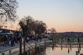 People Enjoying A Winter Evening At Lake Starnberg