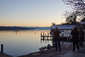 People Enjoying A Winter Evening At Lake Starnberg