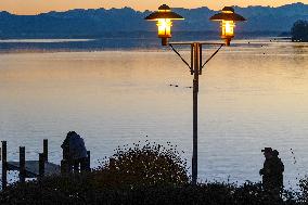 People Enjoying A Winter Evening At Lake Starnberg