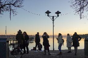 People Enjoying A Winter Evening At Lake Starnberg