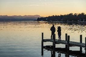 People Enjoying A Winter Evening At Lake Starnberg