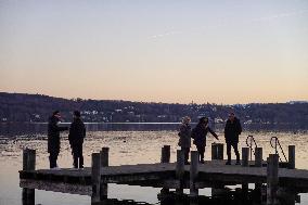 People Enjoying A Winter Evening At Lake Starnberg