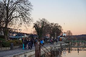 People Enjoying A Winter Evening At Lake Starnberg