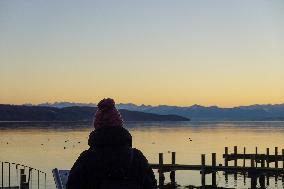 People Enjoying A Winter Evening At Lake Starnberg