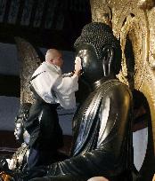 Buddhist statues at Yakushi-ji get dust-down for New Year