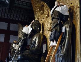 Buddhist statues at Yakushi-ji get dust-down for New Year