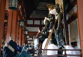 Buddhist statues at Yakushi-ji get dust-down for New Year