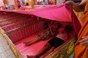 Thai People Lie In Coffins To Welcome The New Year.