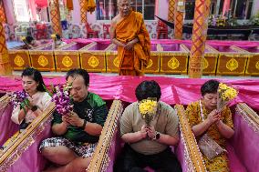 Thai People Lie In Coffins To Welcome The New Year.