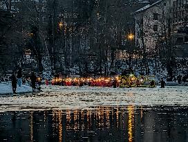 New Year's Torchlight Swim In The Bavarian River Lech In Fuessen