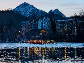 New Year's Torchlight Swim In The Bavarian River Lech In Fuessen