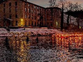 New Year's Torchlight Swim In The Bavarian River Lech In Fuessen