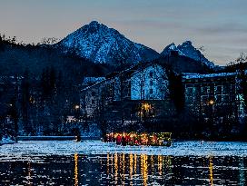 New Year's Torchlight Swim In The Bavarian River Lech In Fuessen