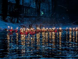 New Year's Torchlight Swim In The Bavarian River Lech In Fuessen