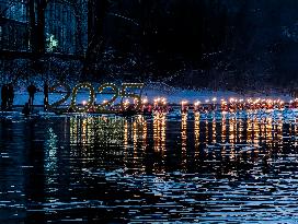 New Year's Torchlight Swim In The Bavarian River Lech In Fuessen