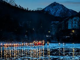 New Year's Torchlight Swim In The Bavarian River Lech In Fuessen