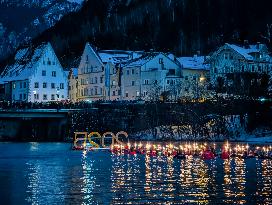 New Year's Torchlight Swim In The Bavarian River Lech In Fuessen