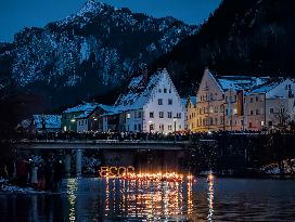 New Year's Torchlight Swim In The Bavarian River Lech In Fuessen