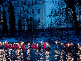 New Year's Torchlight Swim In The Bavarian River Lech In Fuessen