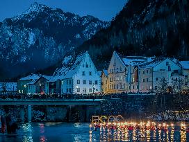 New Year's Torchlight Swim In The Bavarian River Lech In Fuessen