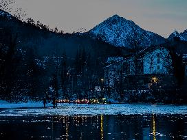 New Year's Torchlight Swim In The Bavarian River Lech In Fuessen