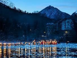 New Year's Torchlight Swim In The Bavarian River Lech In Fuessen