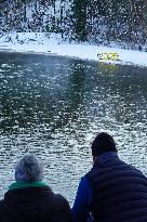 Senior Citizens Reflecting On The New Year By The Water