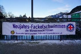 Banner Of New Year Torch Swimming Event In Fuessen