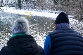 Senior Citizens Reflecting On The New Year By The Water