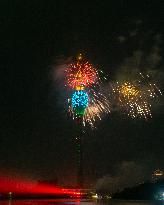 Fireworks Light Up The Sky Near Lotus Tower On New Year's Eve 2025