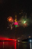 Fireworks Light Up The Sky Near Lotus Tower On New Year's Eve 2025