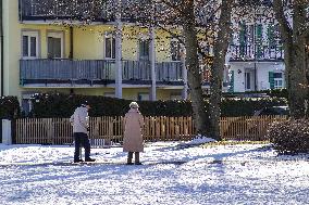 Senior Citizens Strolling In Winter