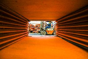 A Worker Drives a Forklift - China