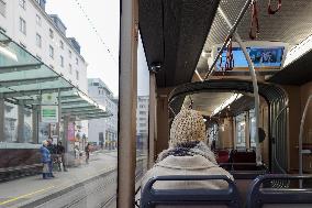 Woman Seated In A Tram