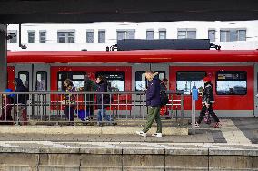 Passengers Waiting For Their Train At Munich East Station