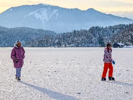 Ice Skating On Frozen Bavarian Lake Staffelsee