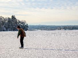 Ice Skating On Frozen Bavarian Lake Staffelsee