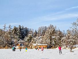 Ice Skating On Frozen Bavarian Lake Staffelsee