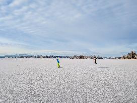 Ice Skating On Frozen Bavarian Lake Staffelsee