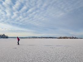 Ice Skating On Frozen Bavarian Lake Staffelsee