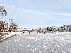 Ice Skating On Frozen Bavarian Lake Staffelsee