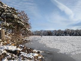 Boys Cycling On Frozen Bavarian Lake Staffelsee