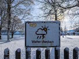 Snow-Covered Weather Warning Sign