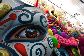 Artisans finish floats for Carnival parade of Blacks and Whites Carnival