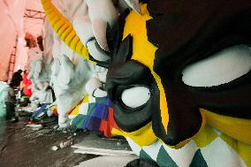 Artisans finish floats for Carnival parade of Blacks and Whites Carnival