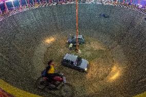 Daredevils Performs Stunts At A State Fair In India.