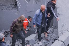 Palestinians Survey The Damage Caused By An Israeli Strike - Gaza